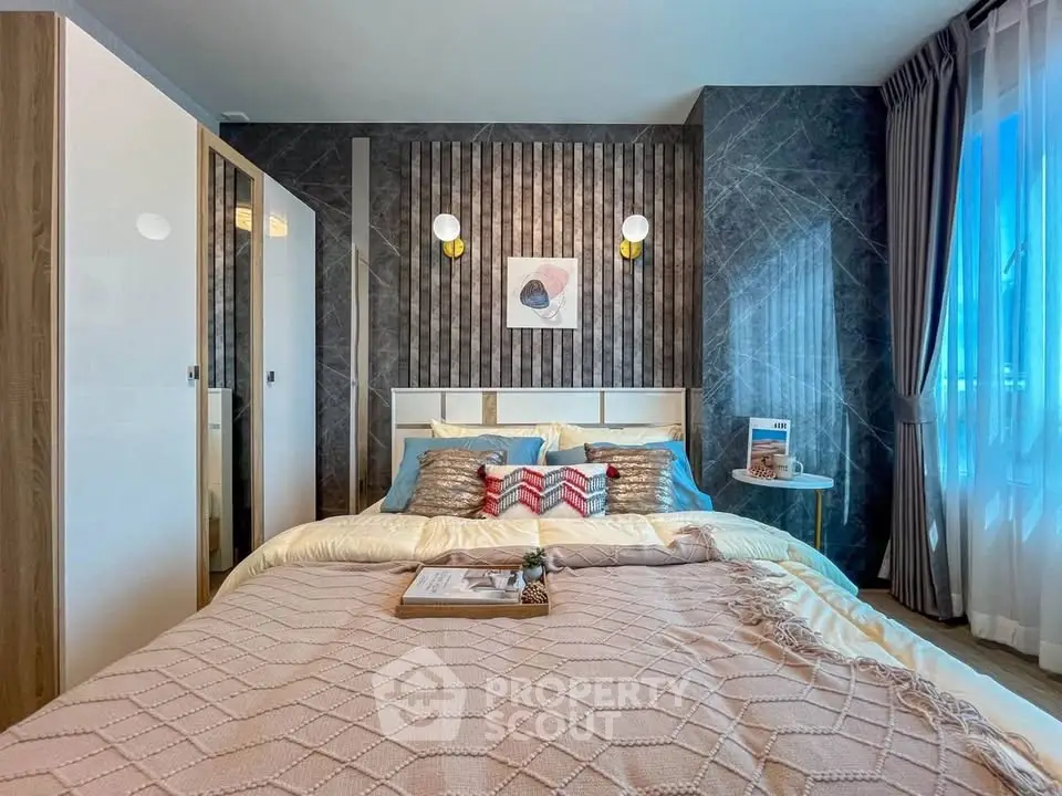 Luxurious bedroom with modern decor and ample natural light
