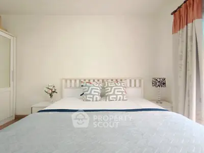 Cozy bedroom with stylish decor and natural light