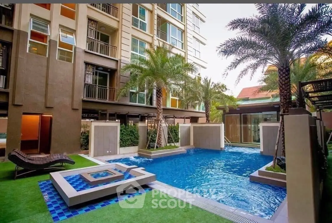 Luxurious condo with stunning pool and lush landscaping