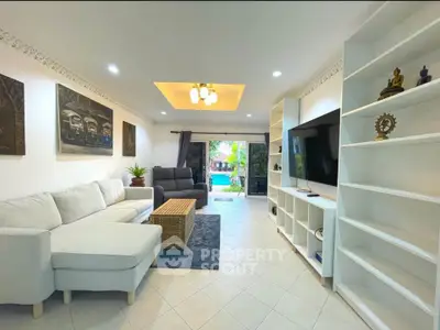 Spacious living room with modern decor and garden view