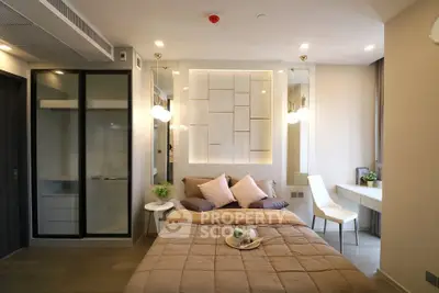 Modern bedroom with stylish decor and cozy ambiance, featuring a comfortable bed and elegant lighting.