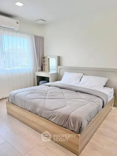 Modern bedroom with natural light and minimalist design