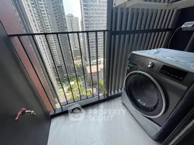 Modern high-rise apartment balcony with washing machine and city view