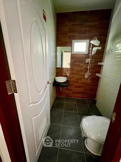 Modern bathroom with sleek fixtures and stylish tile design, perfect for contemporary living.