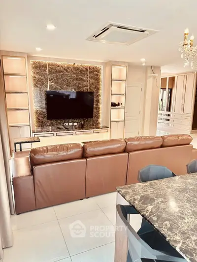 Luxurious living room with marble accents and modern leather sofa