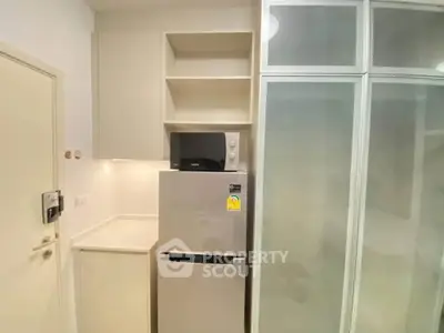 Modern kitchen with sleek appliances and ample storage space