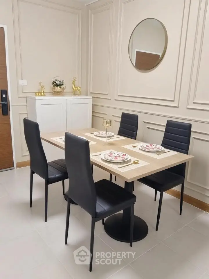 Elegant dining area with modern black chairs and stylish decor, perfect for contemporary living.