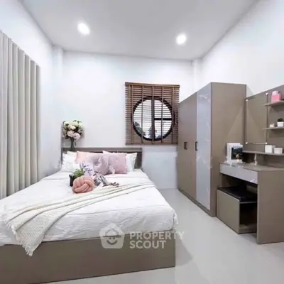 Modern bedroom with stylish decor and ample storage space