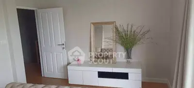 Chic interior with elegant console table and mirror in a stylish living room setting.