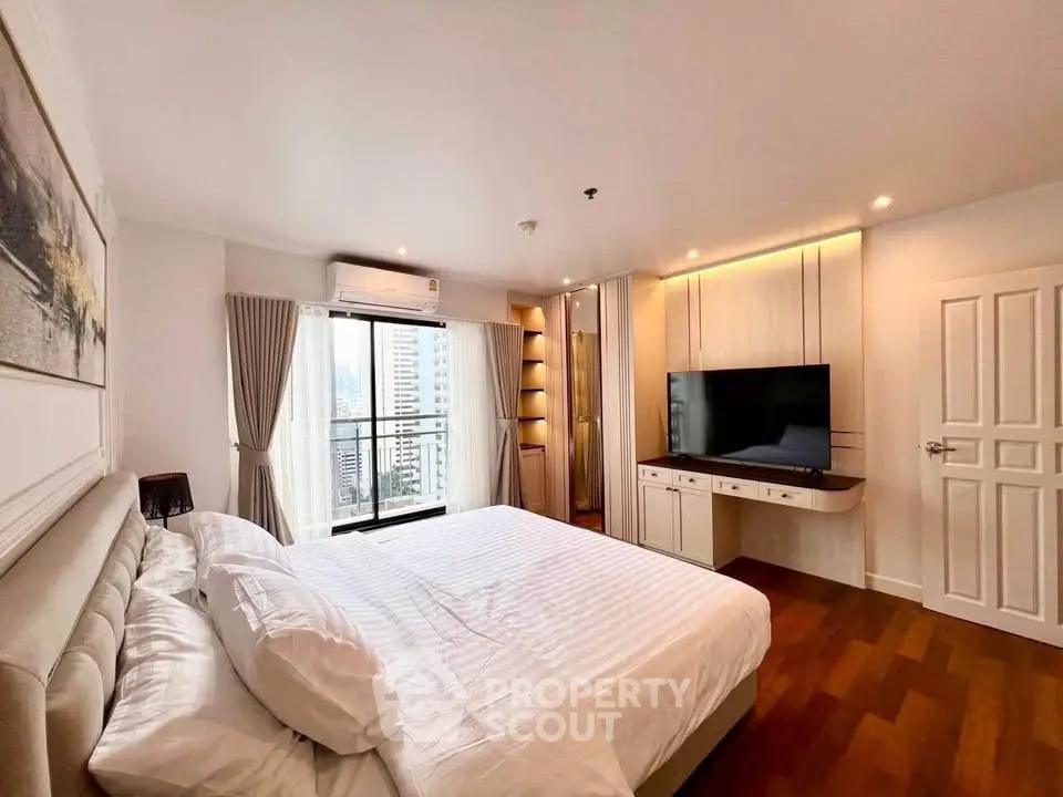 Spacious modern bedroom with city view and elegant furnishings