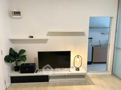 Modern living room with sleek TV setup and stylish lighting