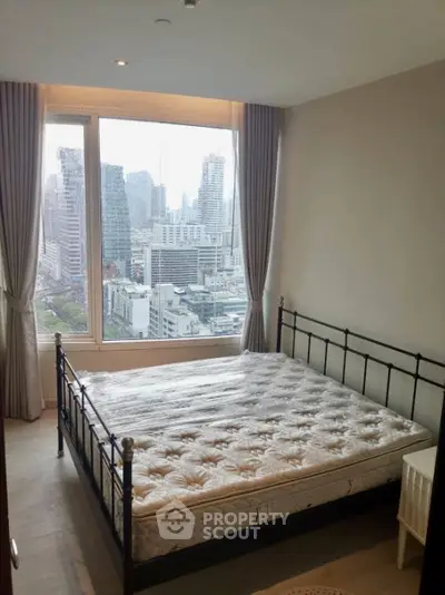 Spacious bedroom with city view in modern apartment