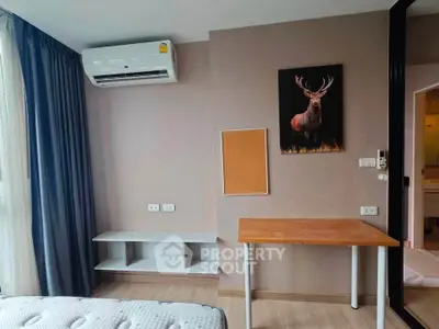 Modern bedroom with air conditioning and stylish decor in a cozy apartment.