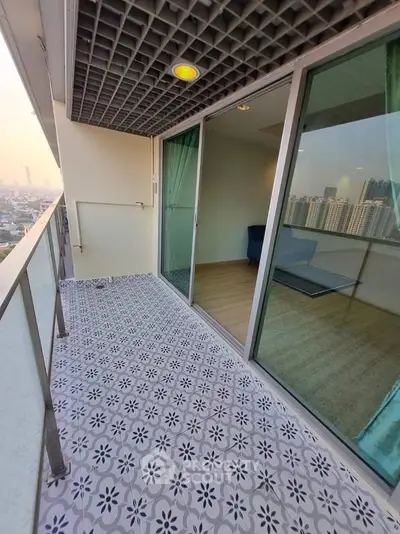 Spacious balcony with city view and stylish tile flooring in modern apartment