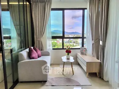 Charming living room with panoramic window view and cozy decor in modern apartment.