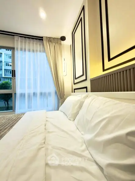 Luxurious bedroom with elegant decor and large window view