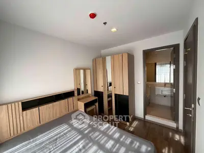 Modern bedroom with ensuite bathroom and stylish wooden furniture