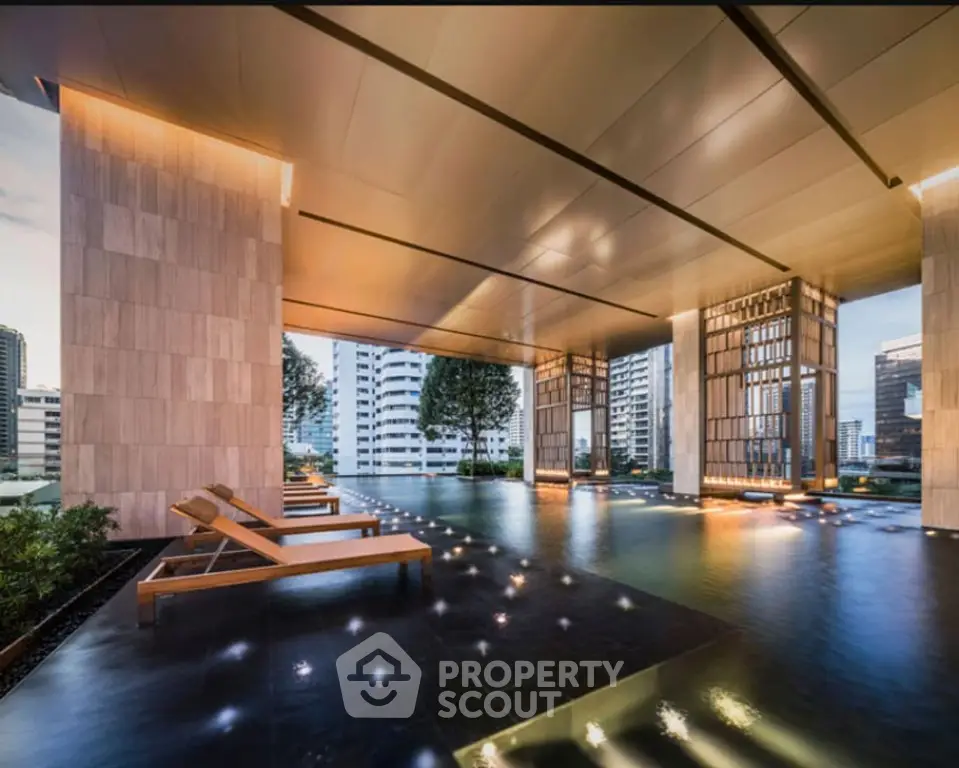 Luxurious rooftop pool with city skyline view and modern design.