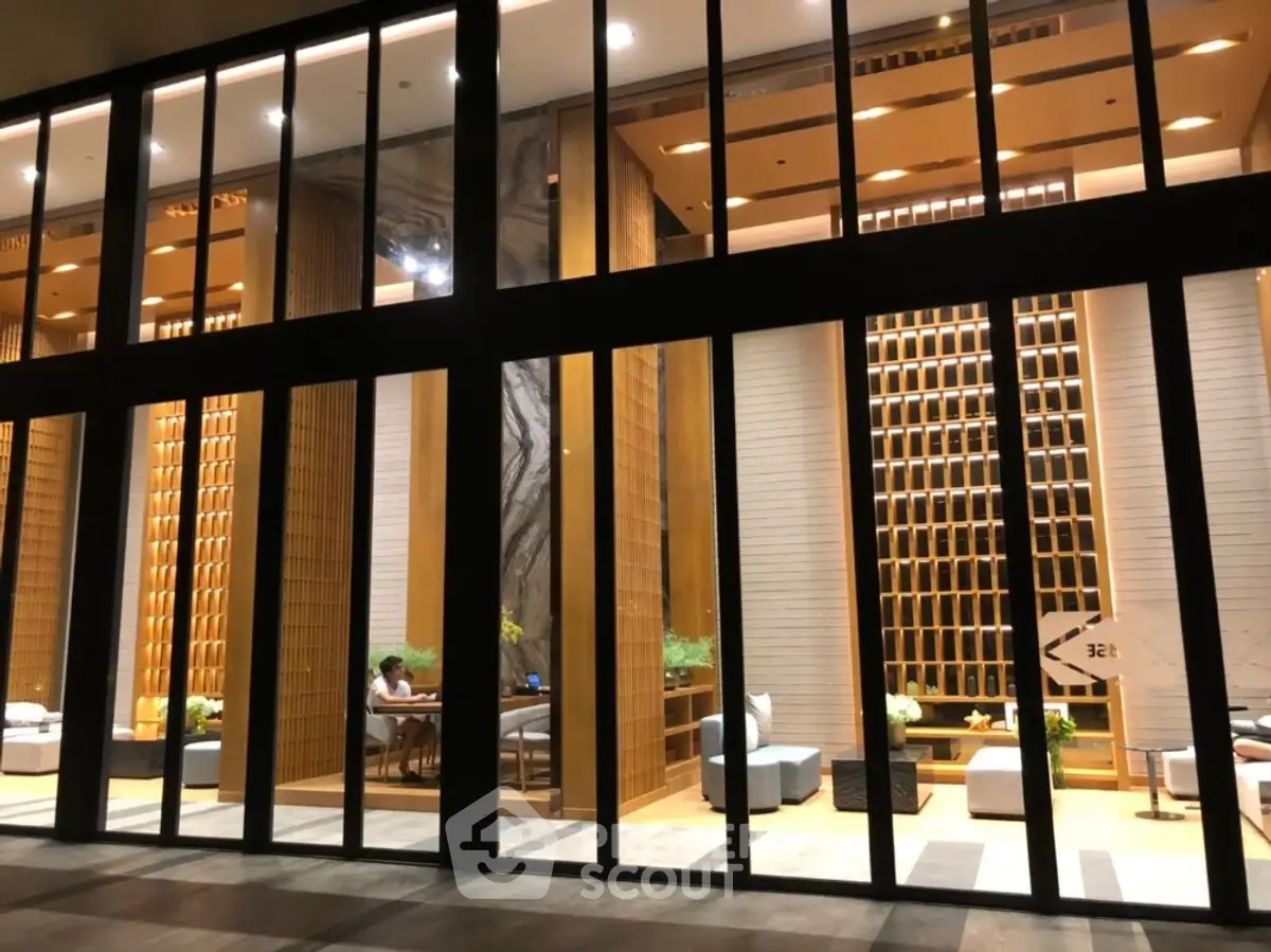 Luxurious modern building entrance with high ceilings and elegant interior design
