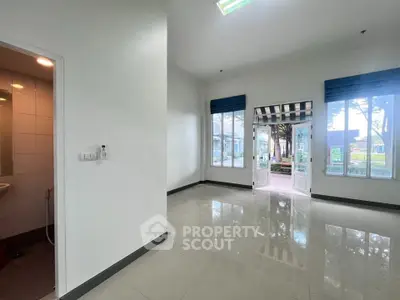 Spacious interior with large windows and garden view, ideal for customization.