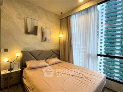 Modern bedroom with large window and city view in high-rise apartment