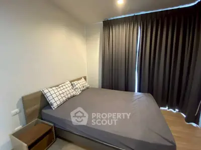 Cozy bedroom with modern decor and ample natural light