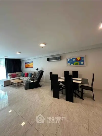 Spacious modern living room with elegant dining area and stylish decor