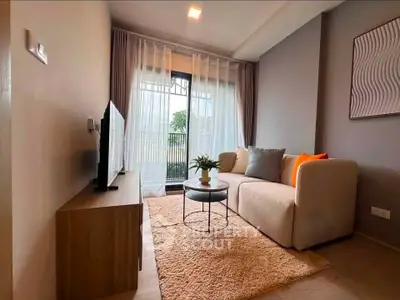 Cozy living room with modern decor and balcony view