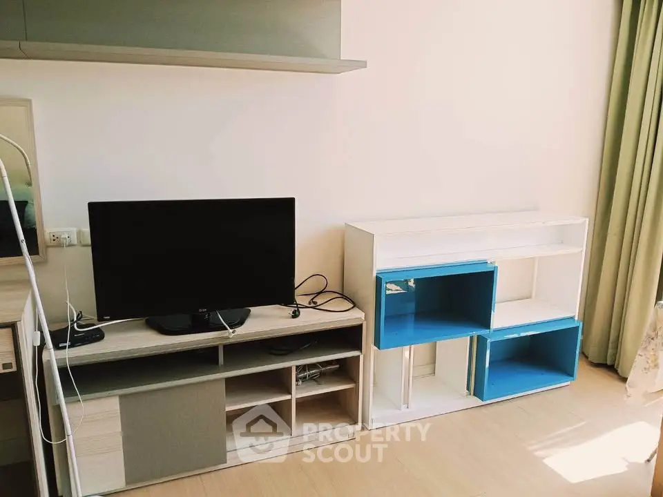 Modern living room with TV stand and stylish shelving unit, perfect for contemporary urban living.