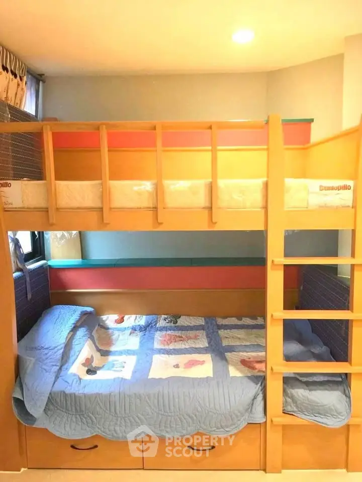 Charming children's bedroom with colorful bunk bed and cozy decor