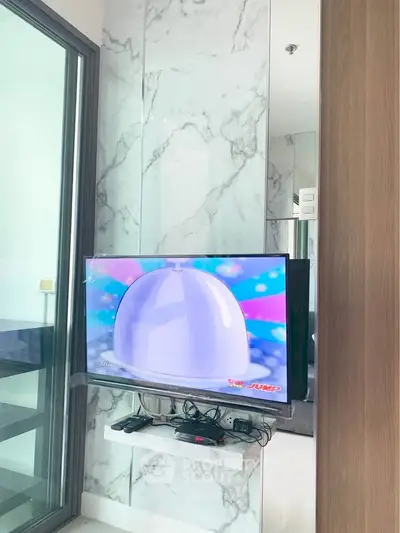 Modern living room with wall-mounted TV and marble accent wall