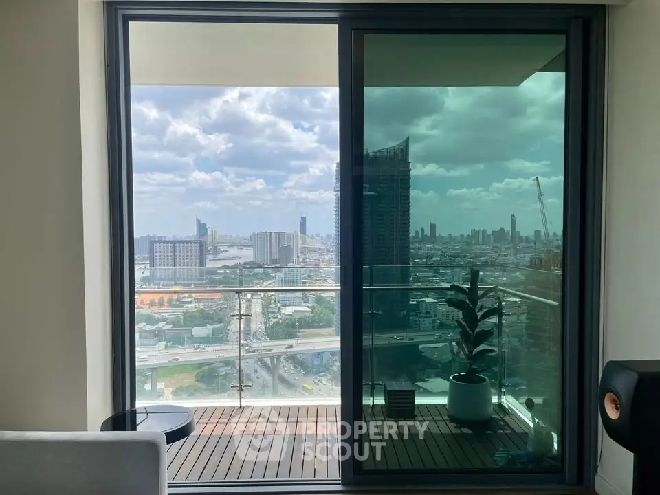 Modern apartment with stunning city view from spacious balcony.