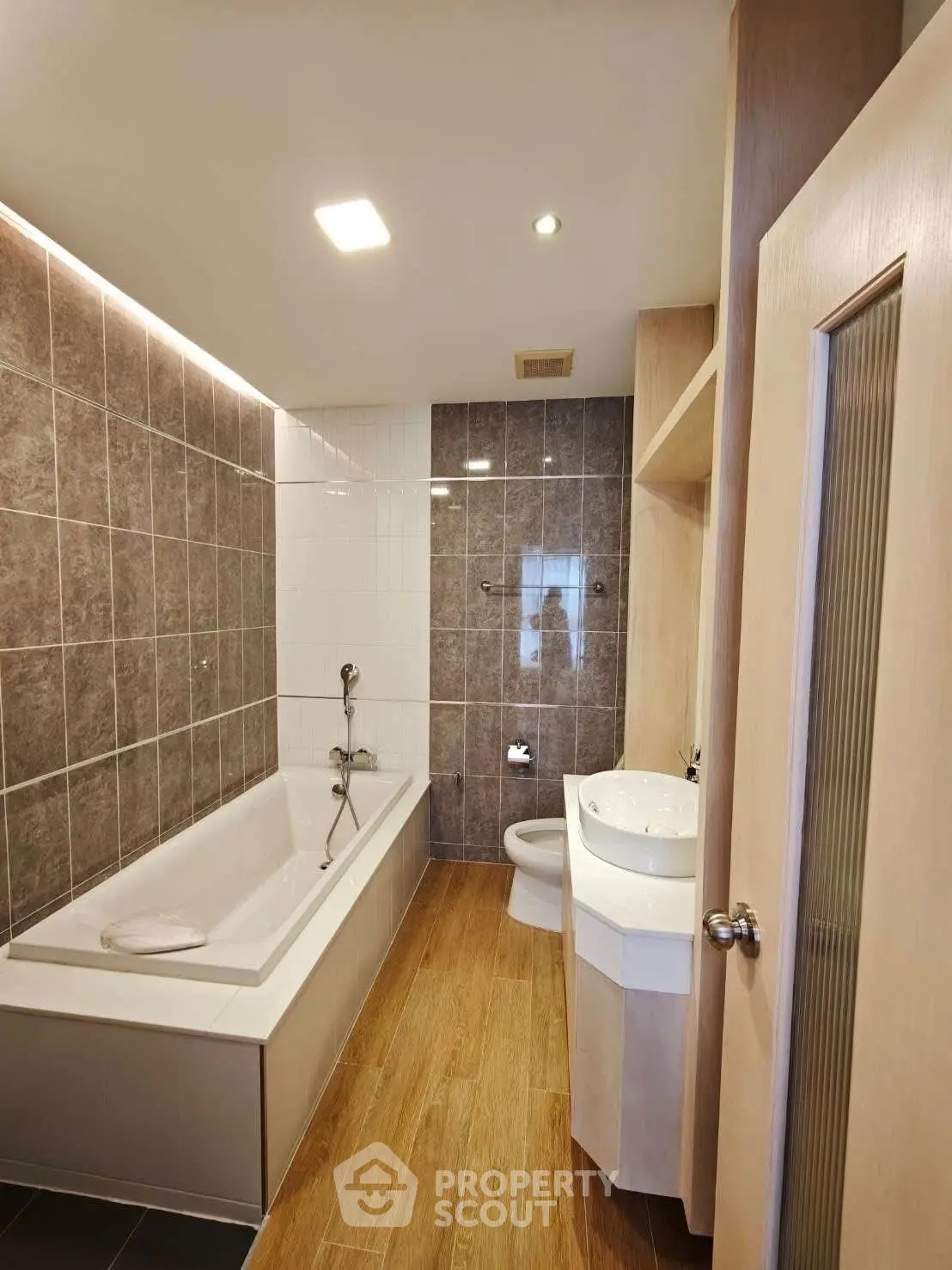 Modern bathroom with bathtub and stylish tile design