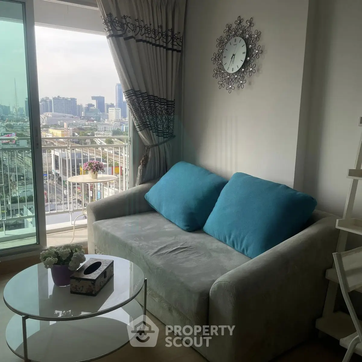 Chic living room with cozy sofa and city view balcony in modern apartment