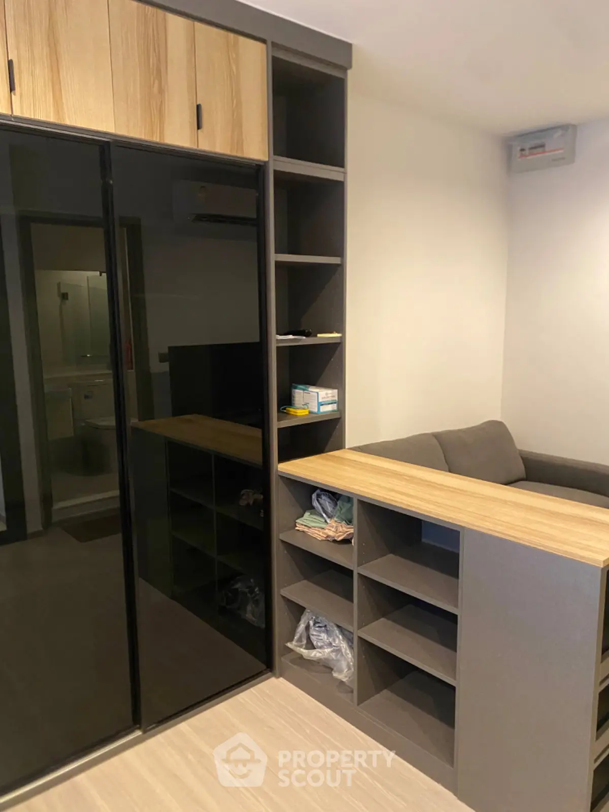 Modern living room with sleek storage and cozy seating area