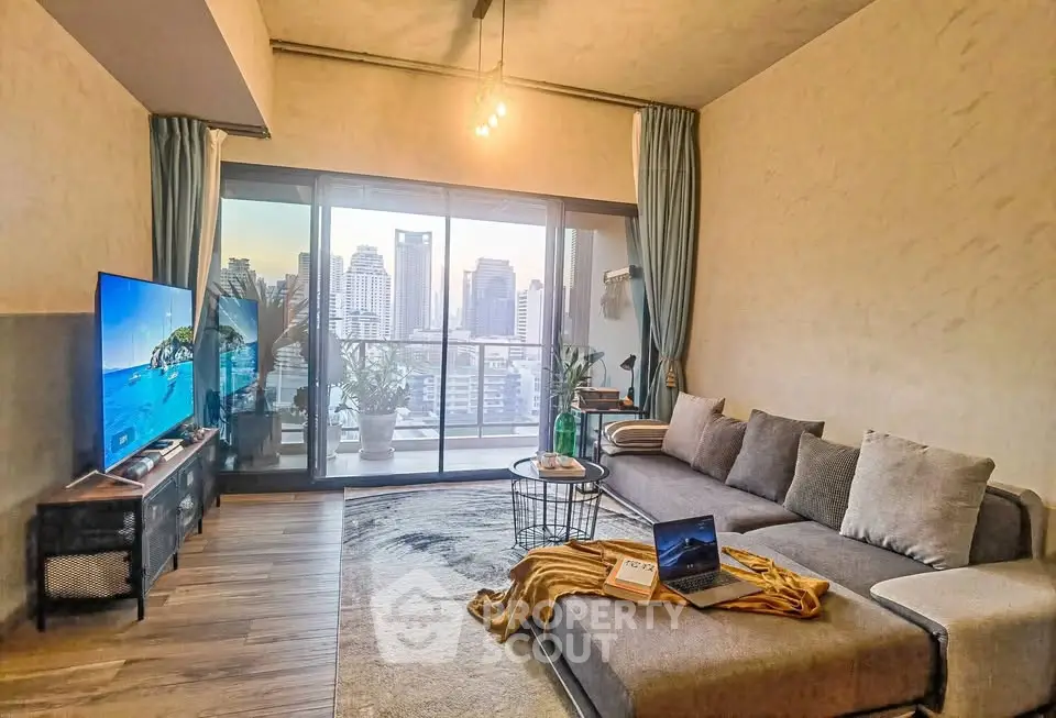 Spacious living room with modern decor and city view balcony, perfect for urban living.