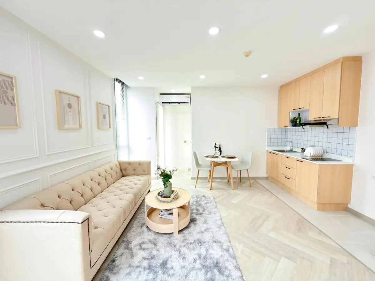 Modern open-plan living room with stylish kitchen and elegant decor