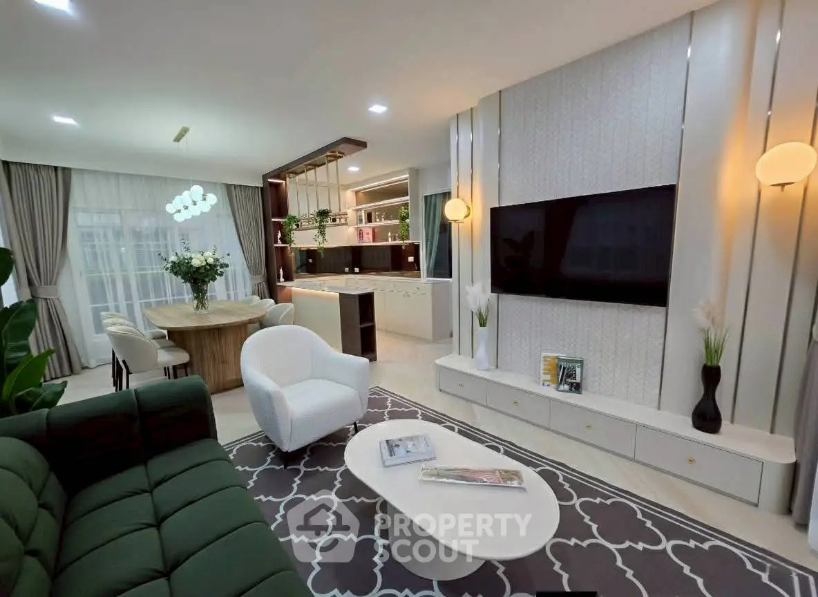 Luxurious modern living room with open kitchen and elegant decor