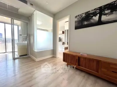 Spacious modern living area with wooden flooring and stylish decor