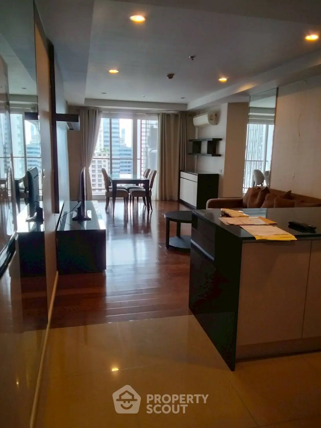 Spacious modern living room with city view and elegant furniture