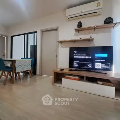 Modern living room with air conditioning and stylish furniture, perfect for comfortable living.