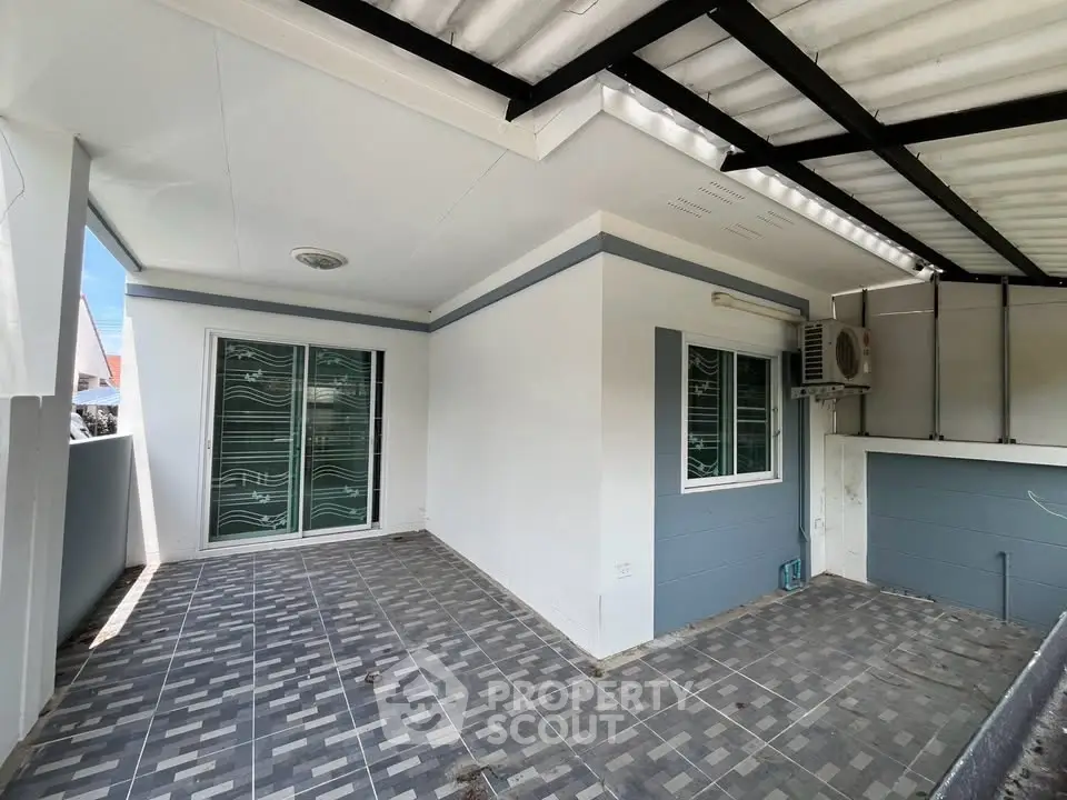 Spacious balcony with modern design and tiled flooring, perfect for outdoor relaxation.