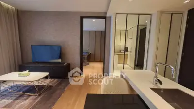 Modern living room with open kitchen and stylish decor in luxury apartment