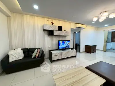 Modern living room with stylish shelving and cozy seating in a contemporary apartment.