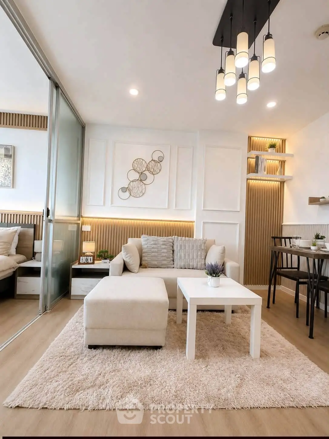 Modern living room with elegant decor, cozy seating, and stylish lighting in a contemporary apartment.