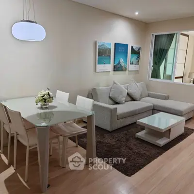 Modern living room with elegant dining area and cozy sofa setup