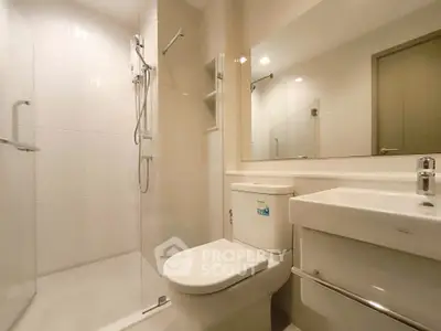 Modern bathroom with glass shower and sleek fixtures