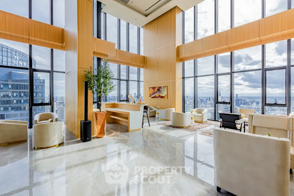 Luxurious high-rise living room with panoramic city views and elegant modern decor.