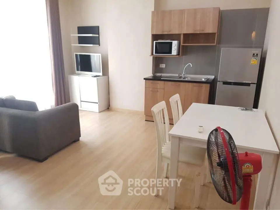 Modern studio apartment with open kitchen and cozy living area