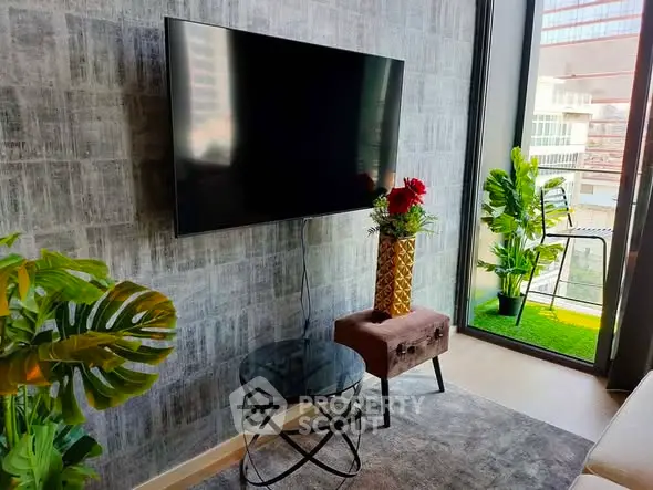 Modern living room with wall-mounted TV and balcony view